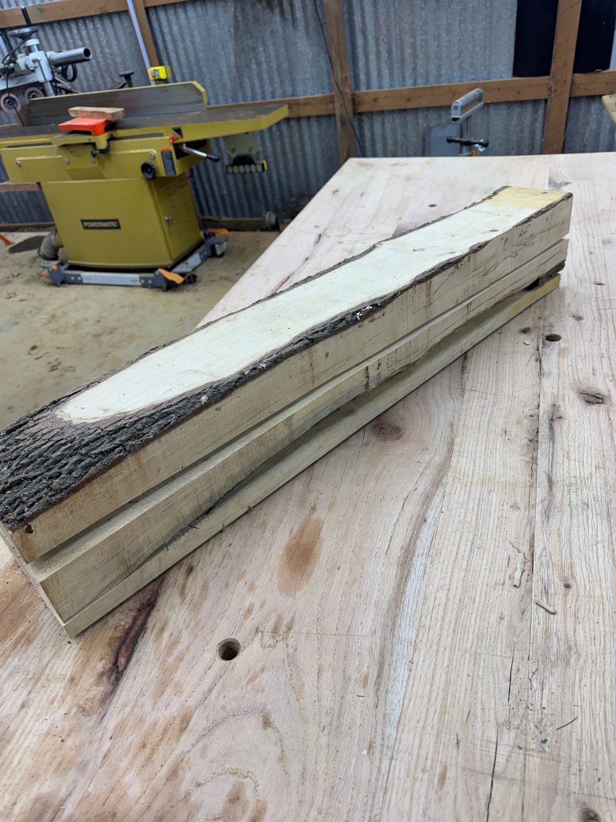 GB001 gum bumelia boards stacked, with one live edge and bark